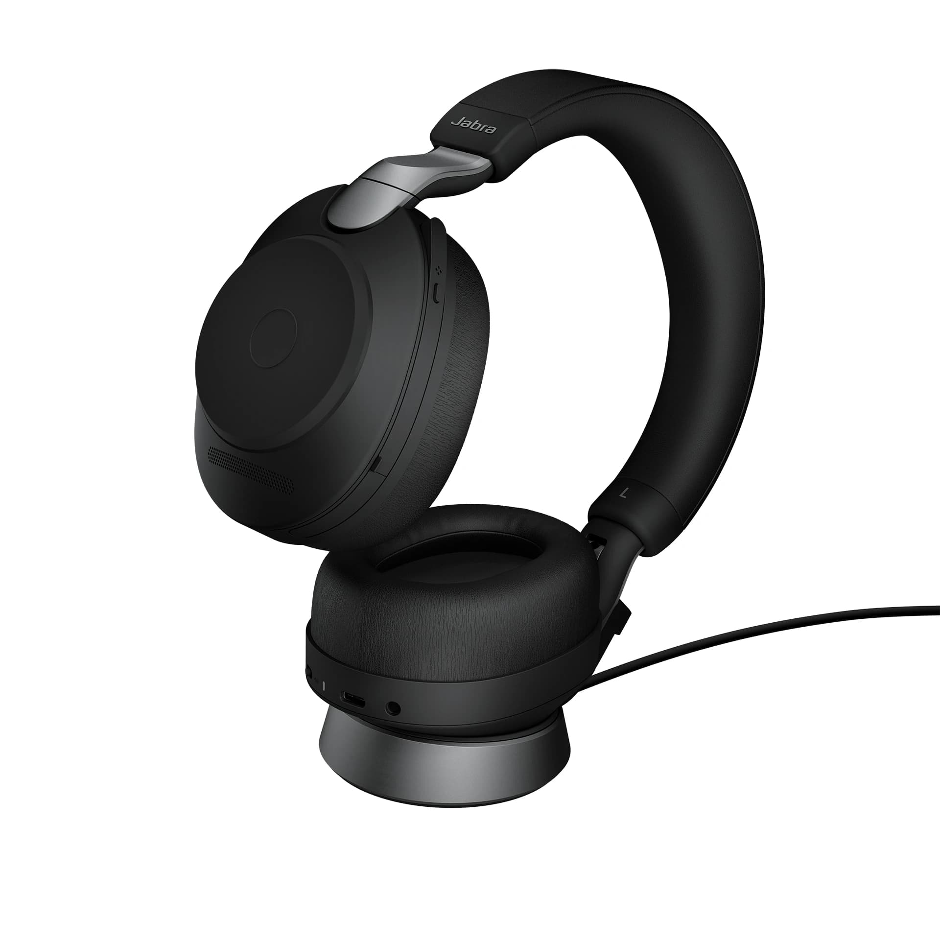 Jabra Evolve2 85 Bluetooth wireless headset docked on its charging stand, studio view