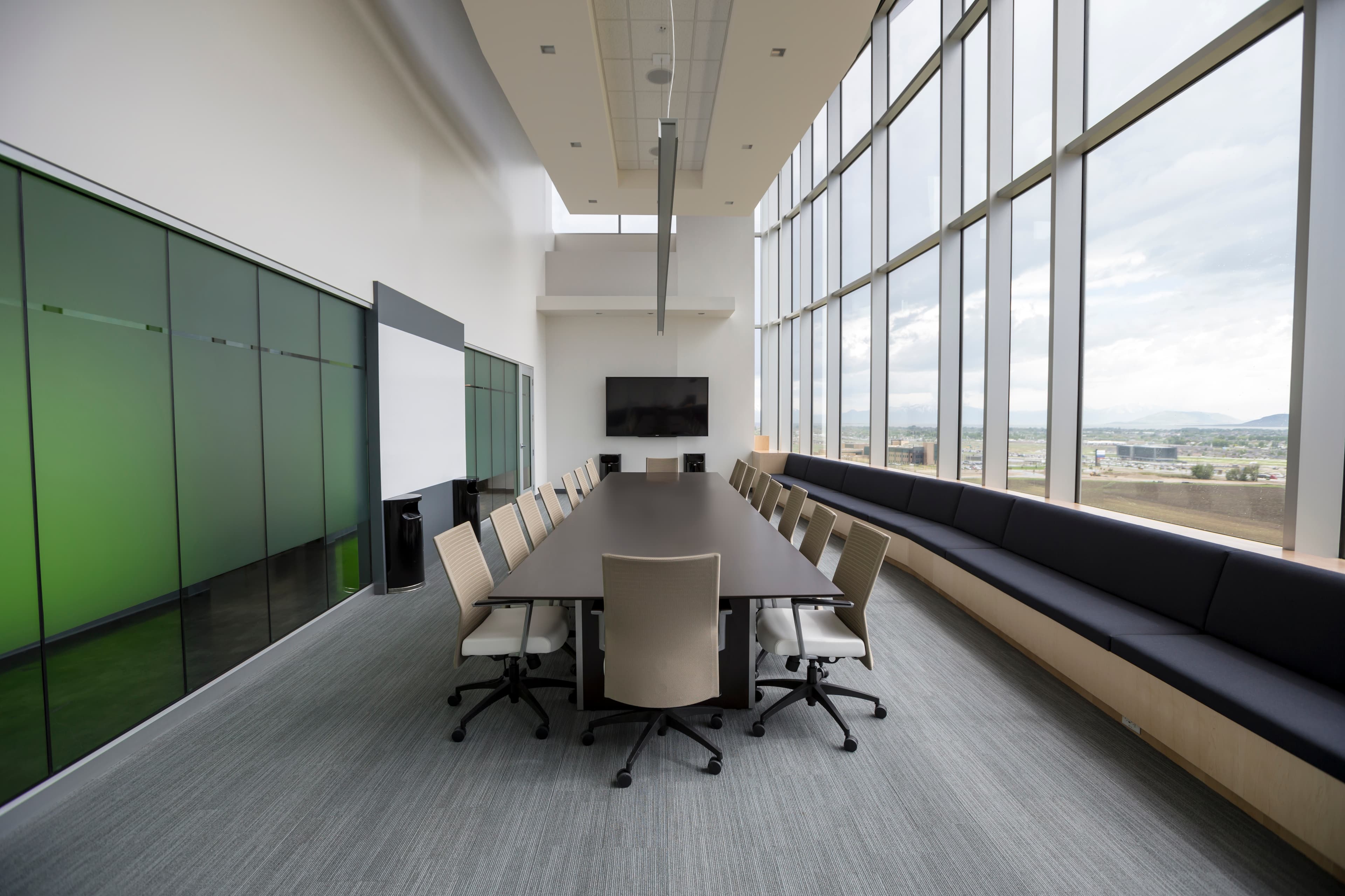 Boardroom AV setup with large display and conferencing system