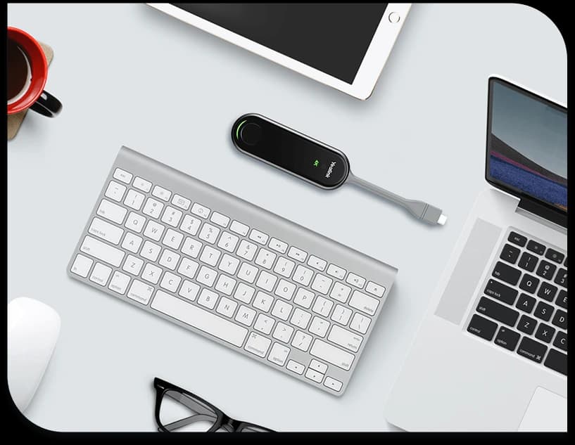 Yealink WPP30, on desk with laptop and tablet