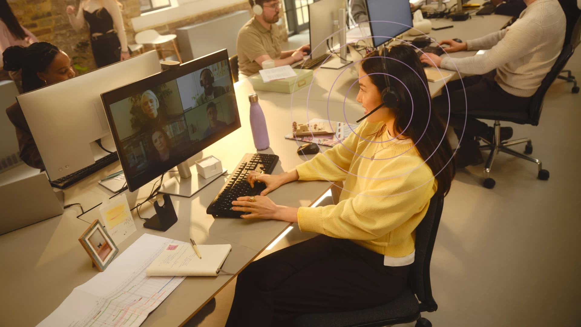 Jabra Evolve3 45 headset worn on a video call in an open-plan office