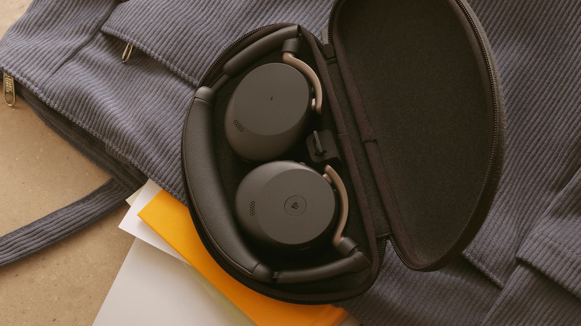 Jabra Evolve3 65 Flex headset folded into its carrying case inside a bag