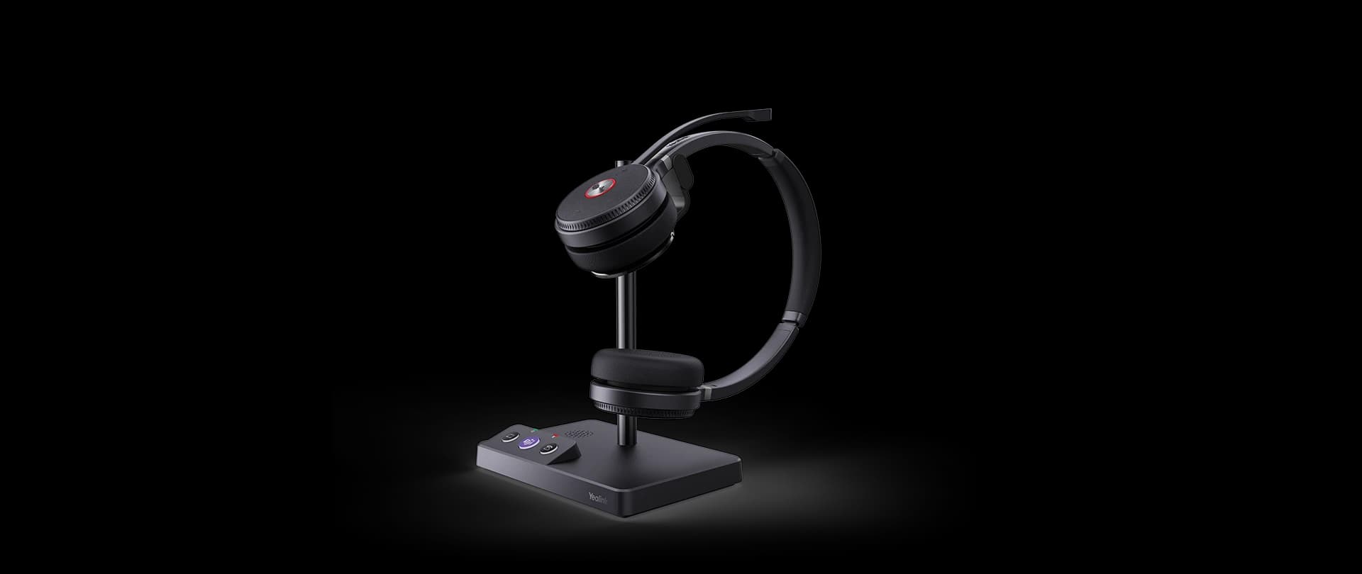 Yealink WH62 Dual headset on its charging base with wireless phone charger, studio view