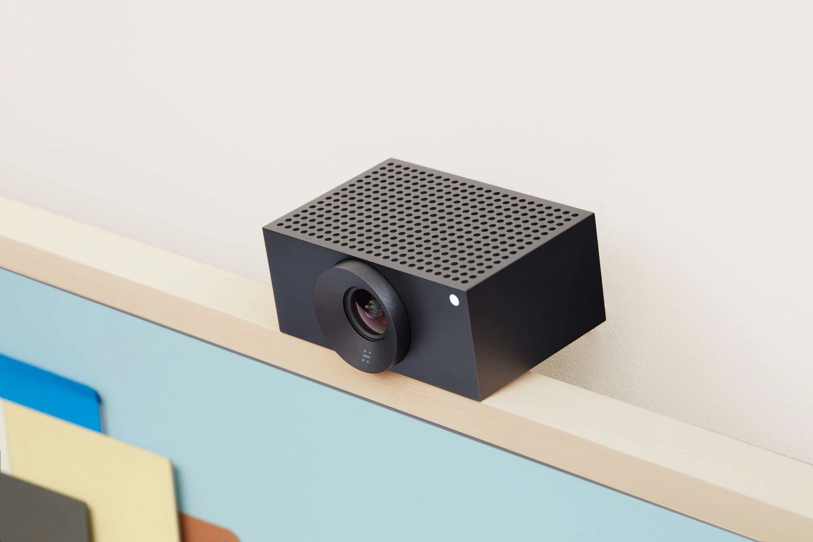 Huddly L1 camera mounted on a shelf edge, angled view