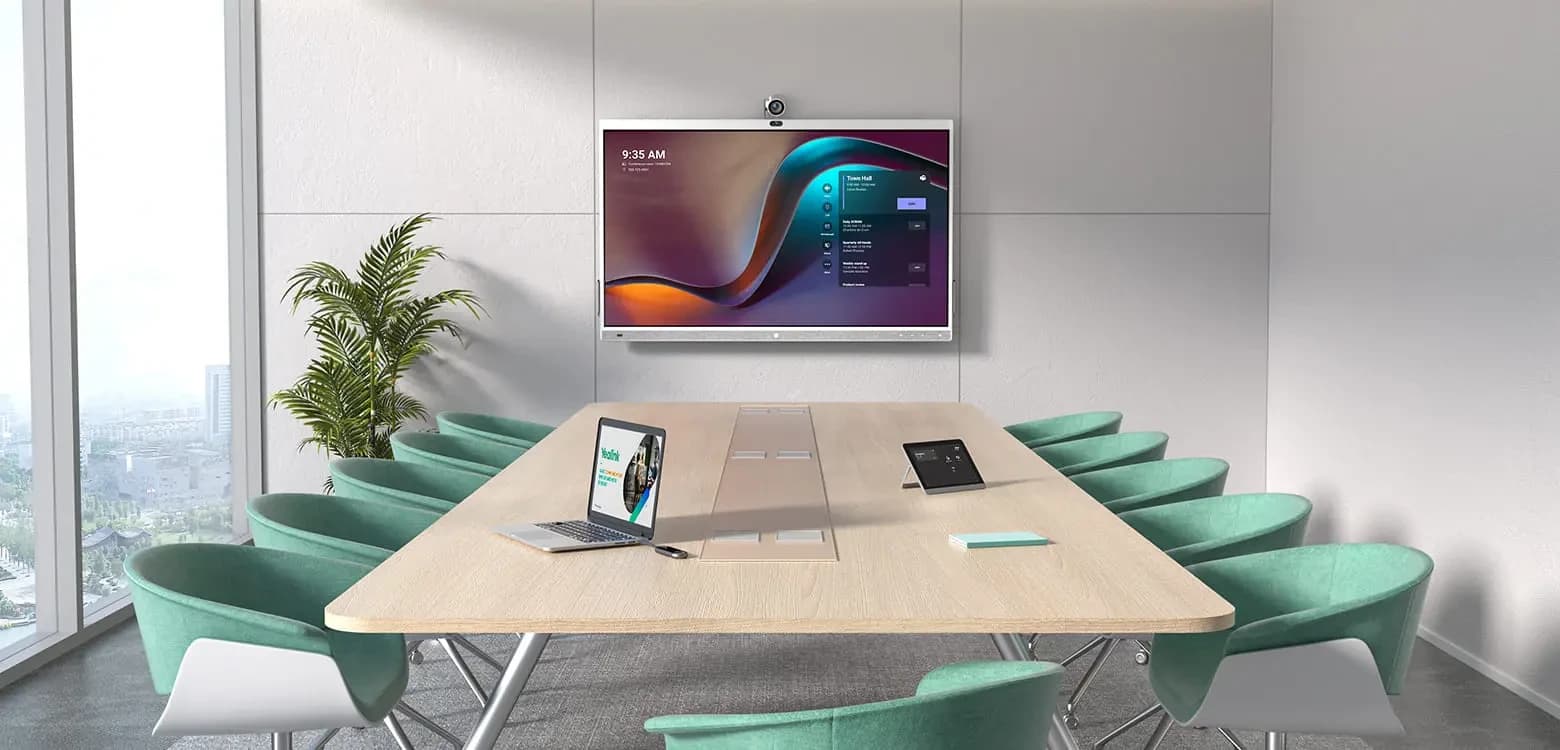 Yealink MeetingBoard 65 Pro wall-mounted in a meeting room